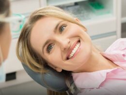 women smiling at her doctor while in the dentist chair