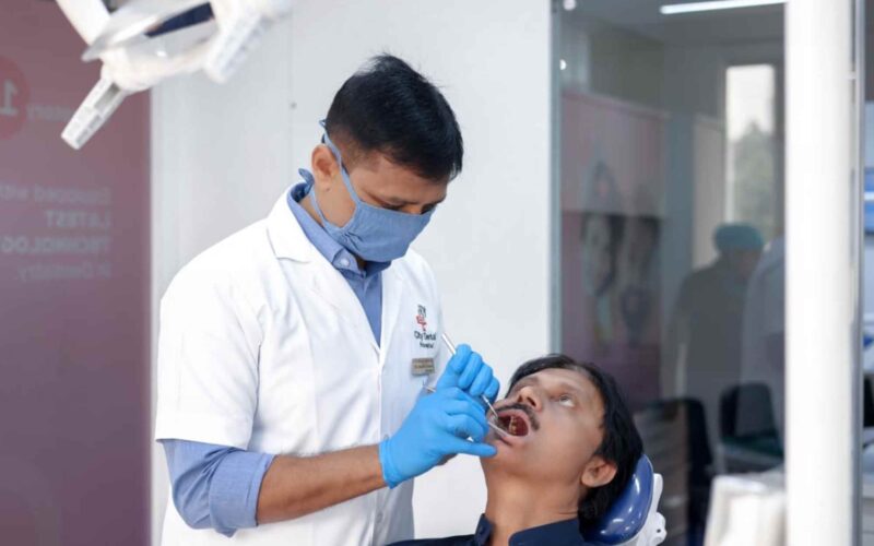 City dental hopsital doctor examining patient for root canal treatment